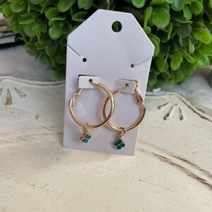 Fashion gold tone hoop earrings with green mini clover charms